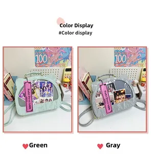 Detail of green and grey cat-ear ita-bags showing the clear PVC window and PU leather texture
