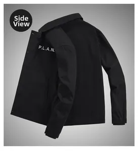 Detail of vintage black sherpa jacket featuring white P.L.A.N. chest logo and twill texture