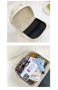 Spacious interior of off-white PU backpack showing compartments for phone and books