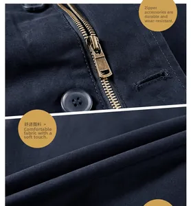 Close-up of durable bronze metal zipper and soft navy blue twill cotton fabric texture