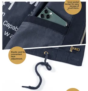 Detail view showing an elasticated inner pocket and adjustable drawstring hem on the jacket