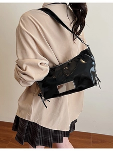 Large black patent leather tote bag for women with silver hardware and shoulder strap