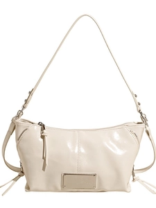 Minimalist beige glossy PU leather shoulder bag with metallic rivets and long strap