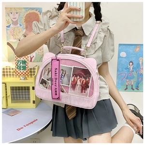 Detailed view of pink cat ear Itabag featuring a clear window and adjustable strap