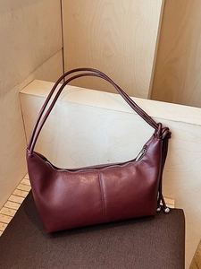 Minimalist burgundy hobo underarm bag in premium faux leather with knot and metal bead detail
