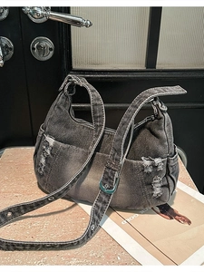 Distressed grey washed denim crossbody hobo bag with ripped fringe detail for women