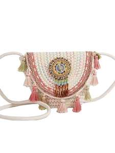 Bohemian woven straw bucket bag with colorful tassels and ethnic beaded medallion details