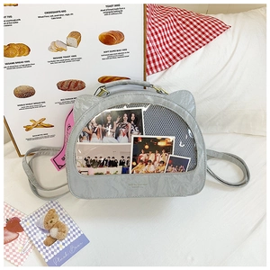 Detail of grey cat-ear ITA bag with transparent window and decorative idol photocards