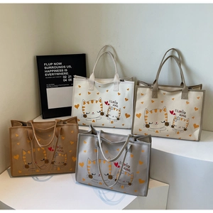 Sacs cabas en toile en quatre tons neutres avec chat orange et imprimé I Love Mum