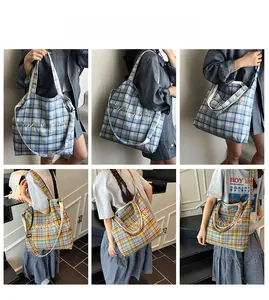 Detail of plaid canvas tote bags showing blue and yellow checkered patterns with dual straps