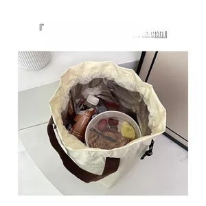 Close-up of insulated lunch bag with aluminum foil lining and spacious interior storage