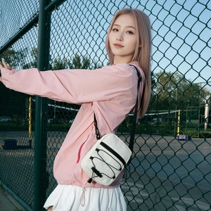 White nylon crossbody bag with black drawstring detail and adjustable strap for sports