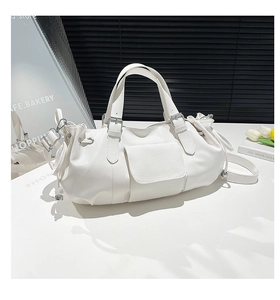 Close-up of white pleated hobo bag featuring litchi grain texture and adjustable buckle straps