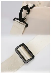 Detail of adjustable nylon shoulder strap with durable plastic hook for travel bag