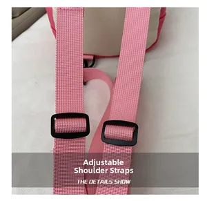 Close-up of pink bag featuring adjustable nylon shoulder straps and durable buckles