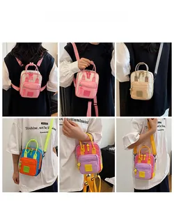 Detail view of multi-way nylon crossbody bag showing versatile carrying styles and compact design