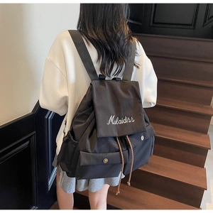Close-up of black waterproof nylon backpack with flap closure and Mulaidiss branding
