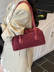 Deep red suede baguette shoulder bag with elegant contrast stitching for women