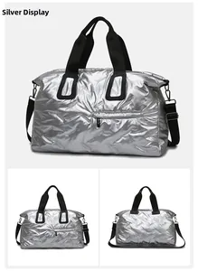 Macro shot of silver quilted travel bag showing waterproof fabric and sturdy handles