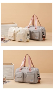 Detail of large capacity travel bag with double front pockets and adjustable strap
