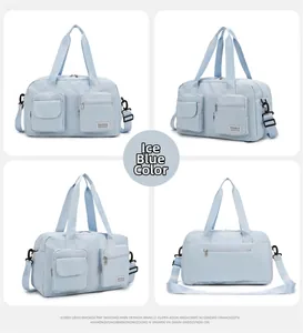 Detail view of ice blue travel bag showing multi-pocket design and waterproof nylon texture