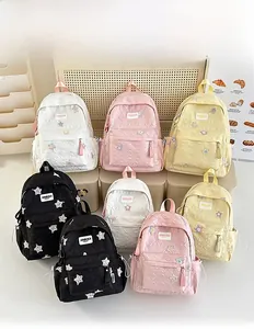 Detailed view of quilted backpacks with star patterns in various sizes and colors