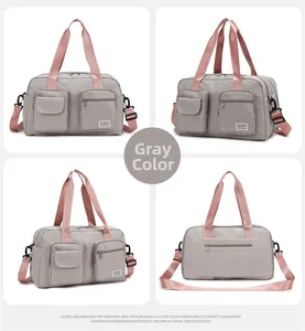 Detailed views of grey travel duffel bag with pink straps and multi-pocket layout