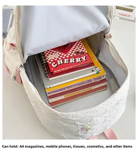 Internal view of quilted star backpack showing large capacity for A4 books and laptop