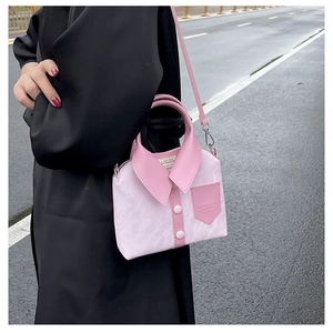 Close-up of pink shirt-style handbag with detailed leather texture and embossed logo