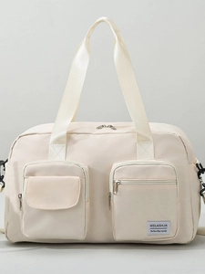 Off-white large travel duffel bag with front pockets and reinforced handles for gym and travel