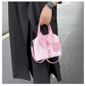 Detail view of pink creative shirt collar handbag with decorative buttons and strap