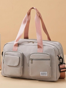 Large capacity grey nylon travel bag with pink handles and detachable shoulder strap