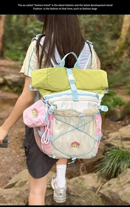 Detail view of colorful hiking backpack with mesh pocket in a forest trekking scene