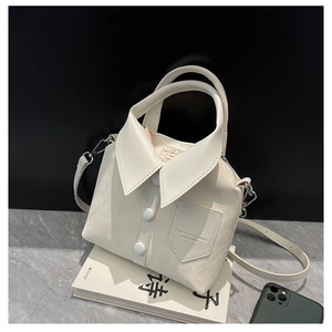 Detail of creative shirt collar design on off-white leather handbag with buttons