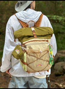 Outdoor hiking backpack in green and beige with mesh pocket and mesh strap details
