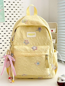 Yellow quilted star backpack for girls with heart pendant and spacious compartments