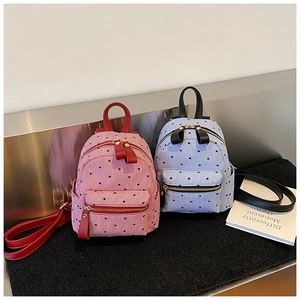 Mini striped backpacks with heart prints in red and light blue colors on display