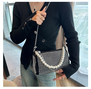 Detail of Boston bag showing shimmering silver rhinestones and elegant pearl handle