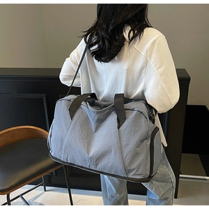Detail view of large fitness bag with independent shoe compartment and durable nylon fabric