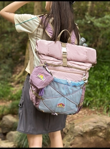Close-up of lightweight outdoor backpack with stretch mesh pocket in a forest setting