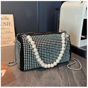 Detail of Boston bag showing cylinder shape, luxury rhinestones and pearl chain handle