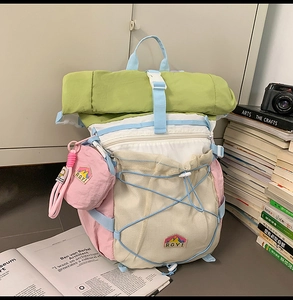 Detail of multi-color high-density nylon backpack with mesh pocket and drawstrings