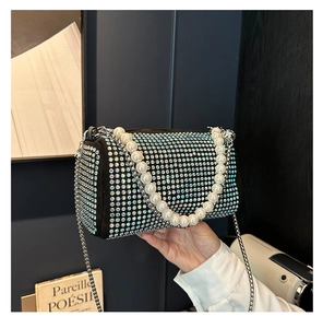 Close-up of luxury Boston bag with colorful rhinestones, pearl handle and metal chain
