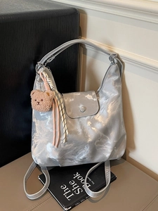 Silver marble pattern tote bag with plush bear charm and stylish wide shoulder strap