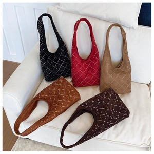 Detail showing five colors of hobo shoulder bags with silver rivet diamond quilting