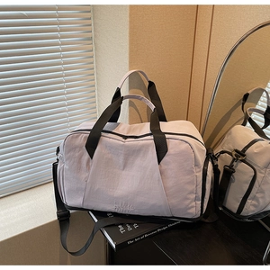 Detail of lavender fitness bag featuring dry-wet separation and durable nylon texture