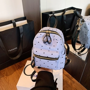 Mini blue striped backpack with heart prints and elegant gold zipper detailing