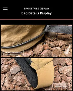 Detail of khaki oxford chest bag showing woven rope hook and breathable mesh strap