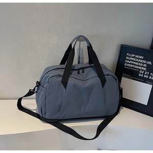 Detail view of large dry-wet separation travel bag with adjustable strap in morandi blue