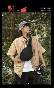 Outdoor black nylon chest bag with adjustable strap and side mesh pocket for travel